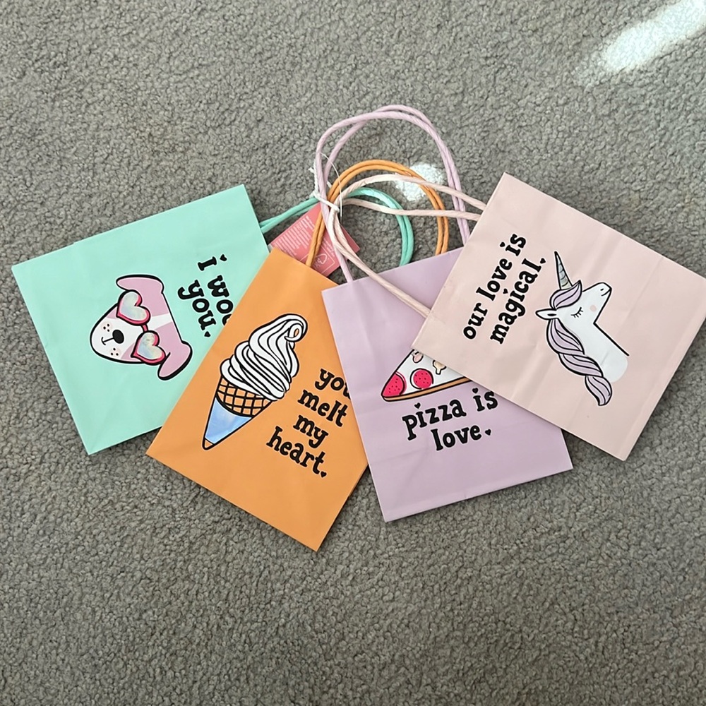 36 gift bags total. 9 sets of 4 mini gift/ party favor bags